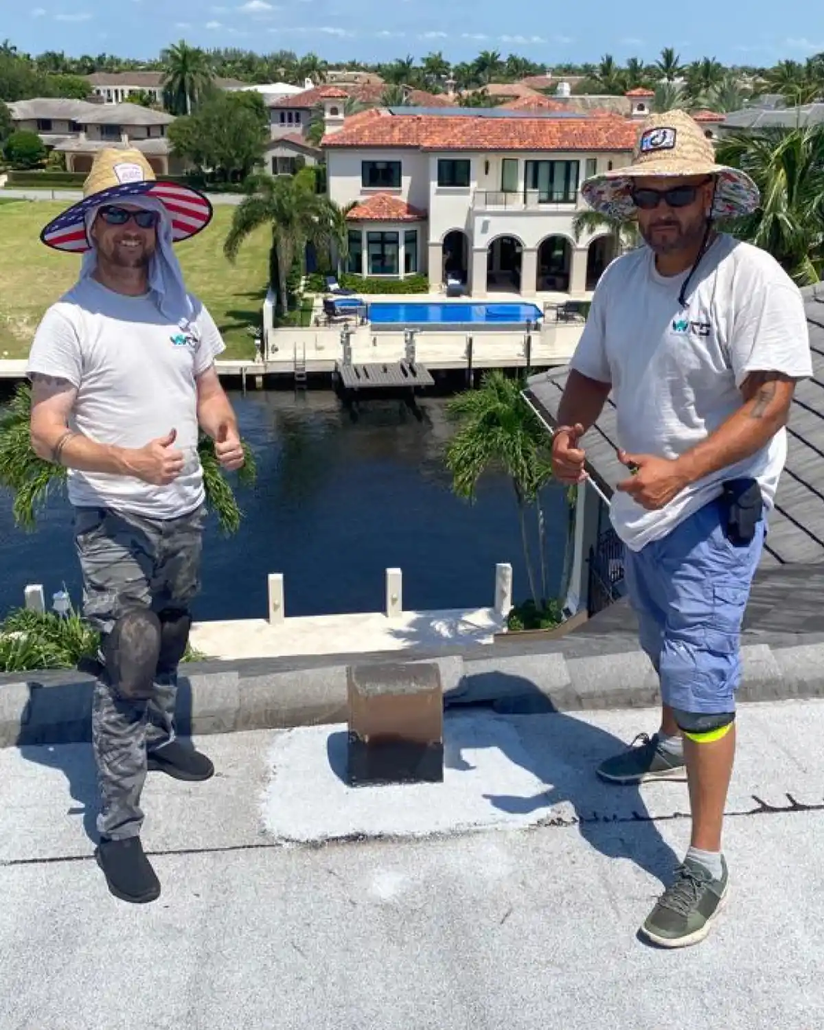 Weather Recovery Solutions Mike and Sam on-site conducting an inspection of a flat roof in South Florida.